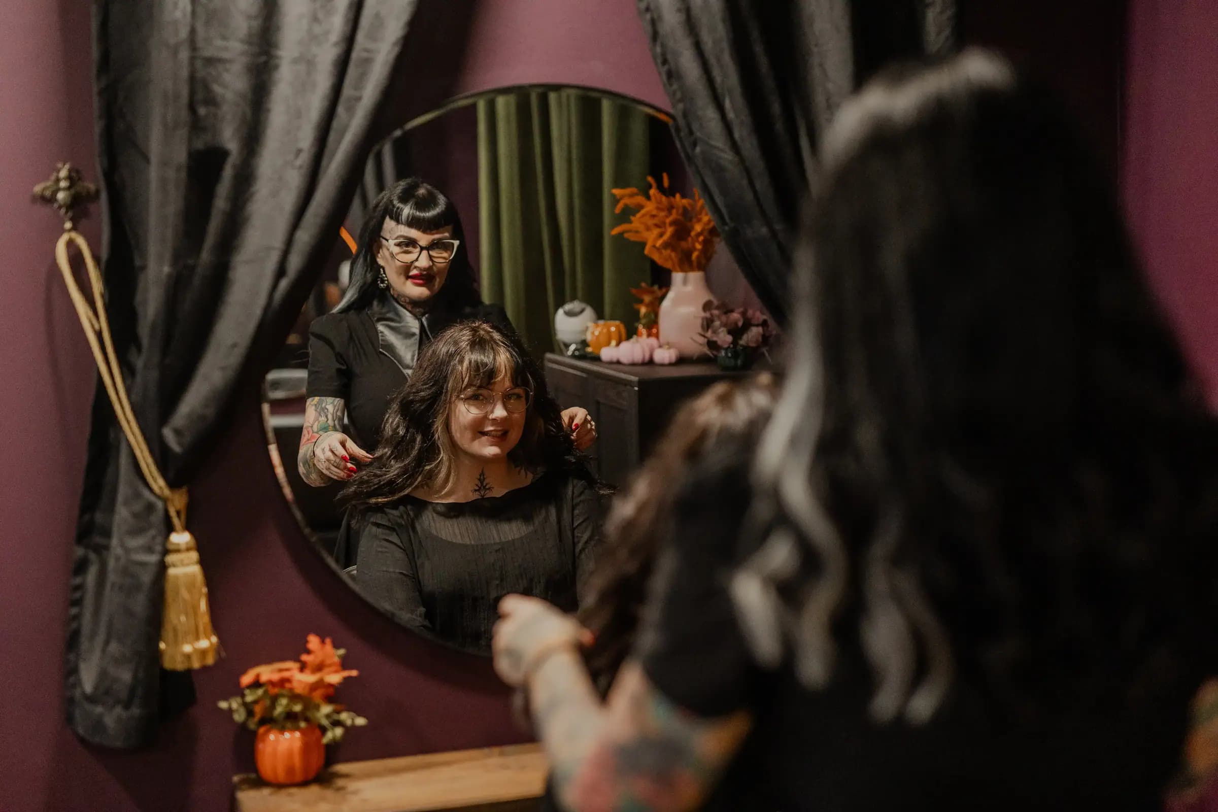 Verity working through a client’s hair at the mirror