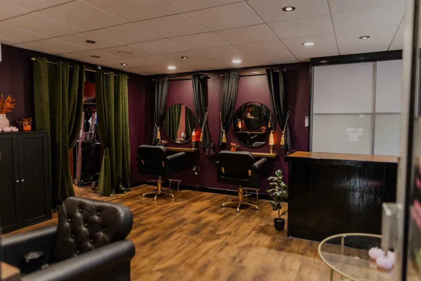 The salon’s styling stations, mirrors lit